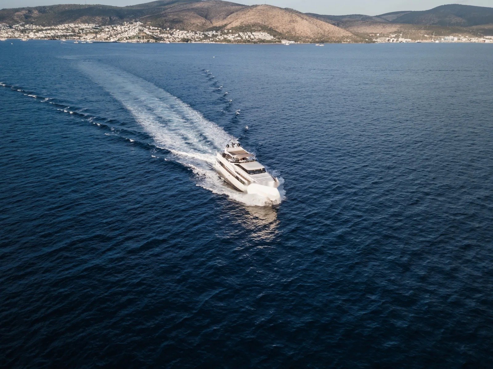 AS3105 31m HG Yachting luxury motor yacht charter Bodrum aerial underway wake starboard view