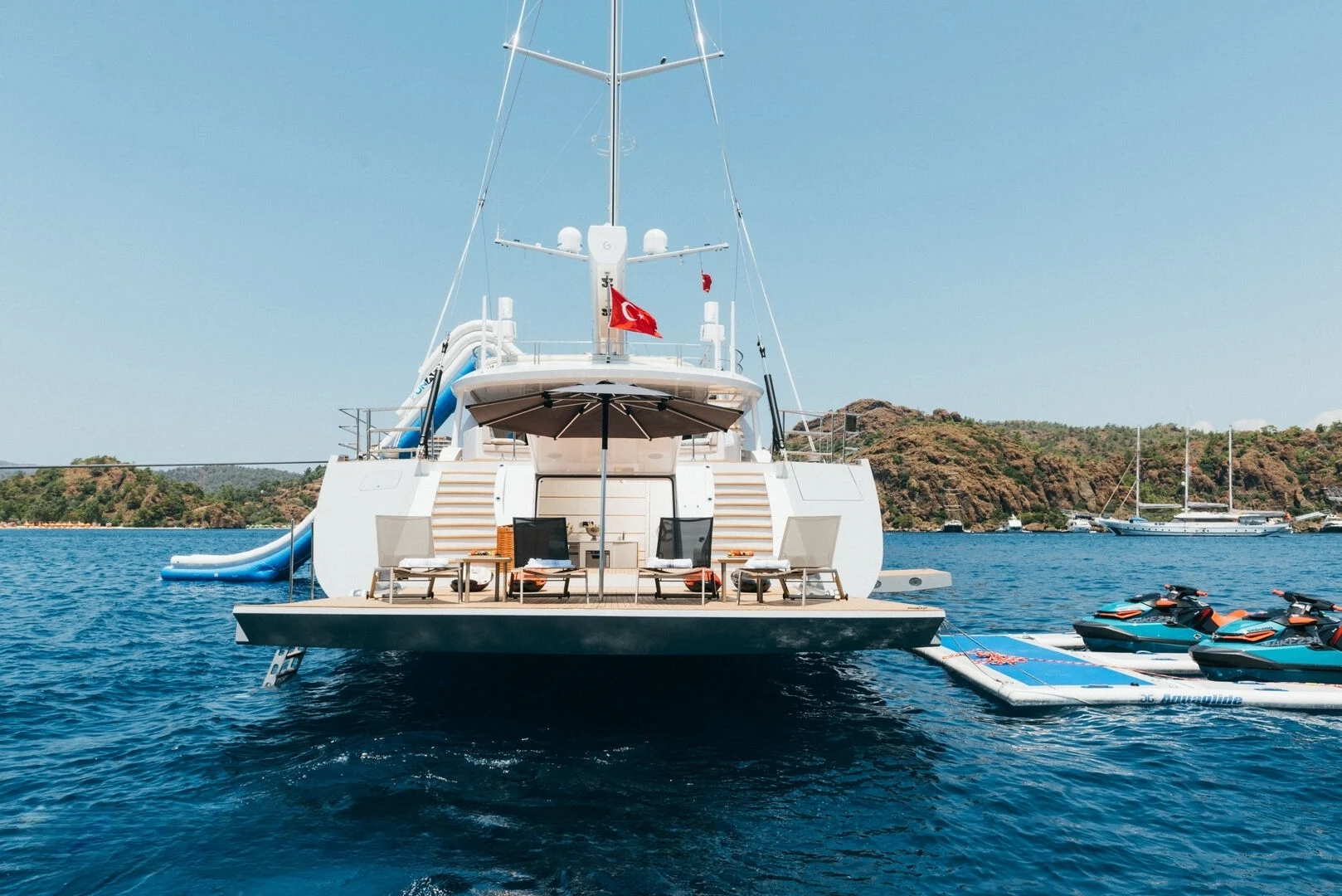 Stern with jet skis and water toys aboard a 50m superyacht charter Turkey — AA5019