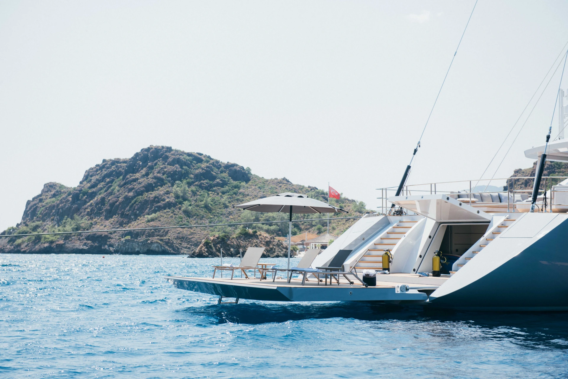 Swim platform with dive tanks and sun loungers, 50m crewed superyacht charter Turkey — AA5019
