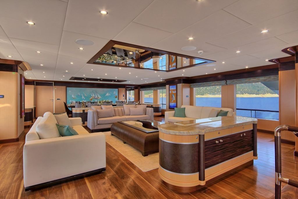 Sky lounge with bar, sofas and dining aboard a 55m superyacht in Turkey