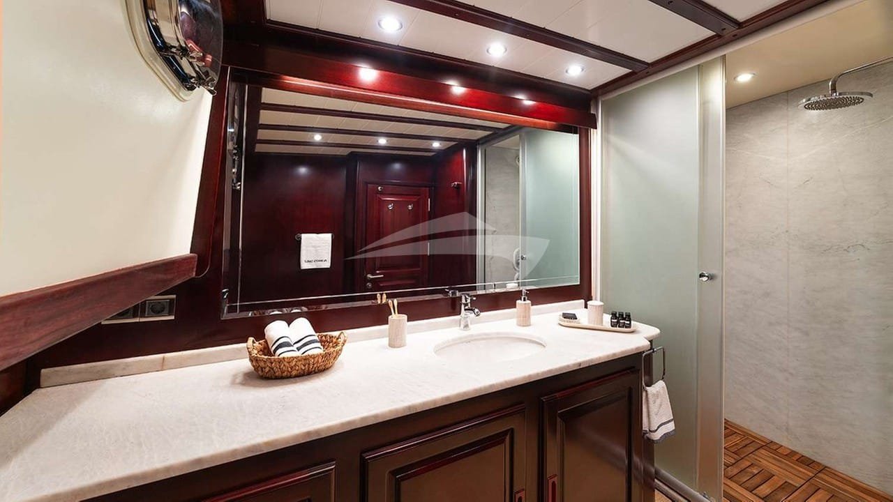Guest bathroom of a crewed motor yacht charter in Gocek with twin basins and a walk-in shower