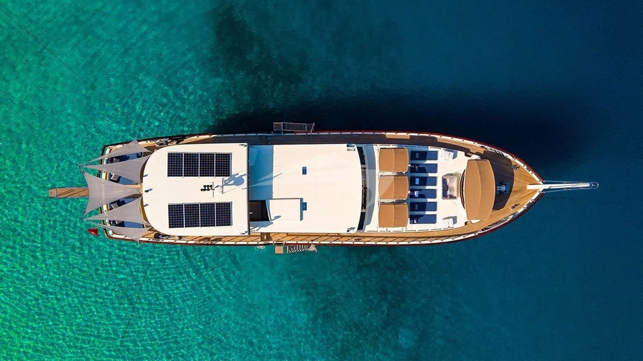 Crewed motor yacht charter Gocek photographed from directly overhead in turquoise water