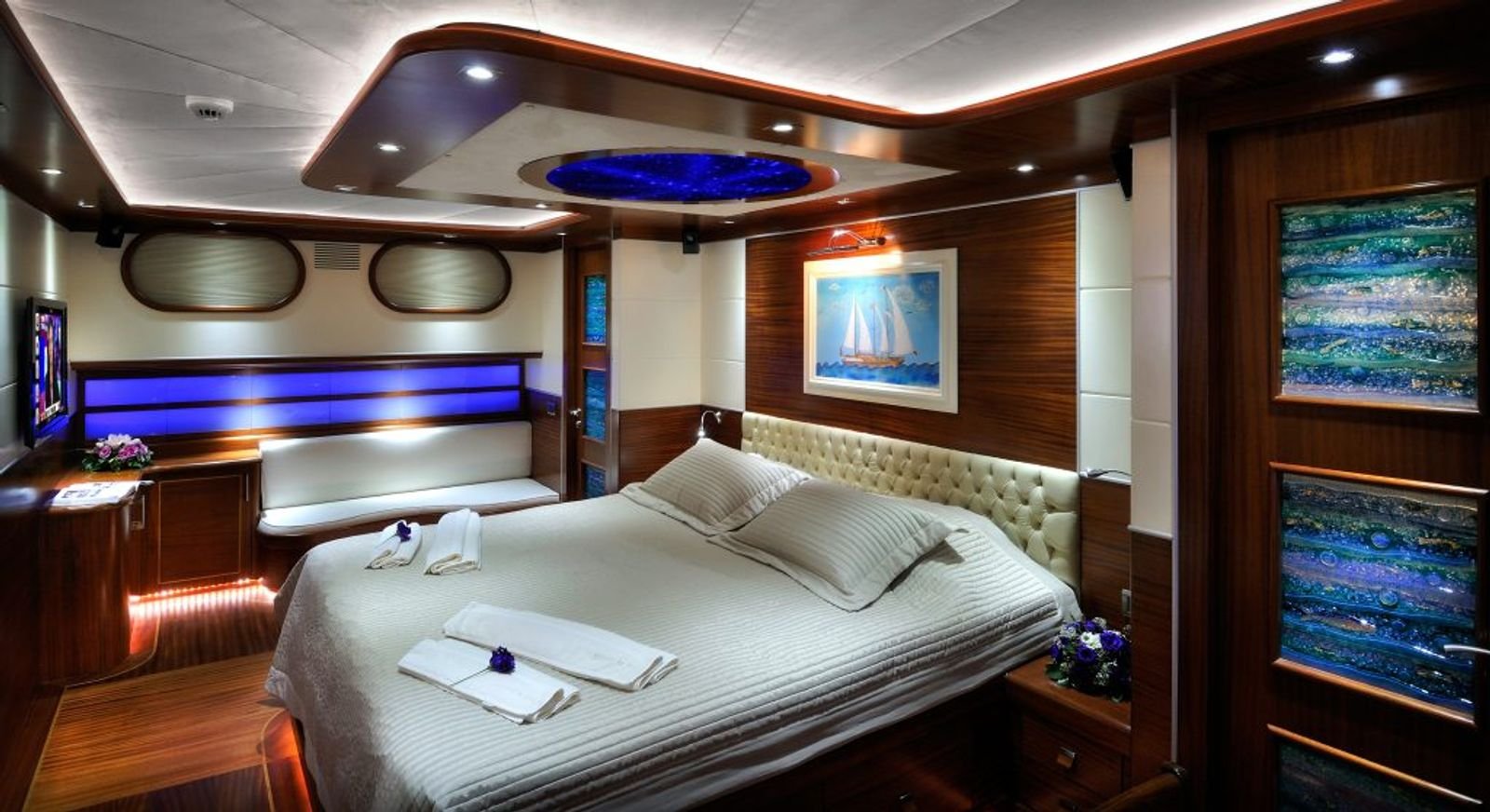 Master cabin with king bed and sofa seating aboard a deluxe gulet in Turkey