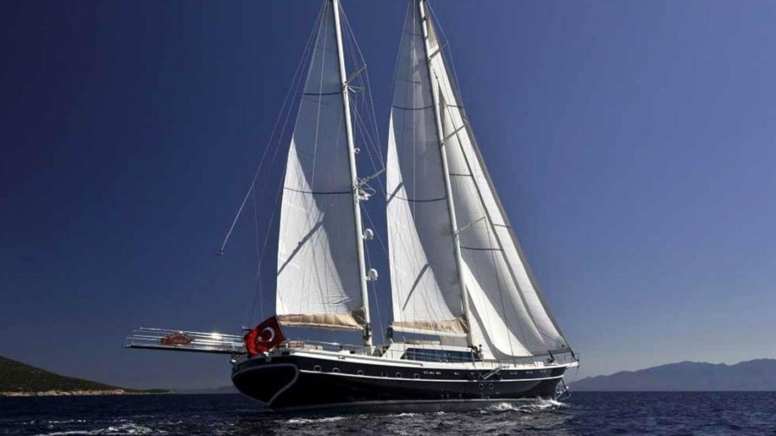 Deluxe gulet charter Turkey - 36m three-masted gulet under full sail off the Aegean coast