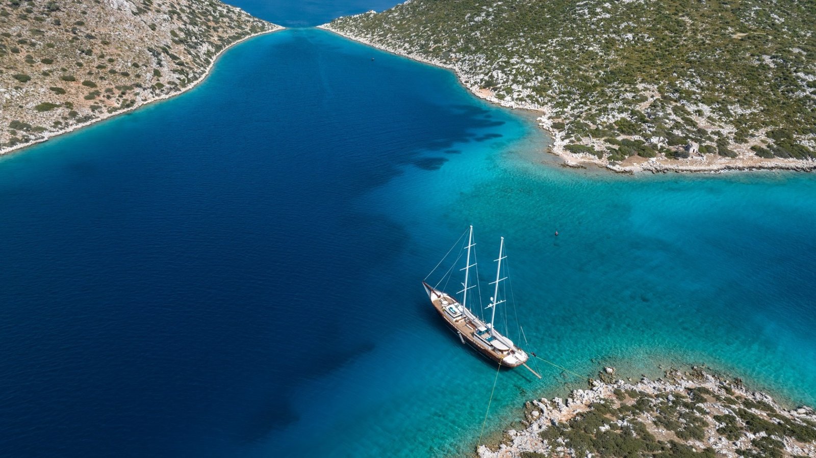 Aerial of a 43m gulet anchored in a turquoise bay, Turkish Riviera charter — MN4308