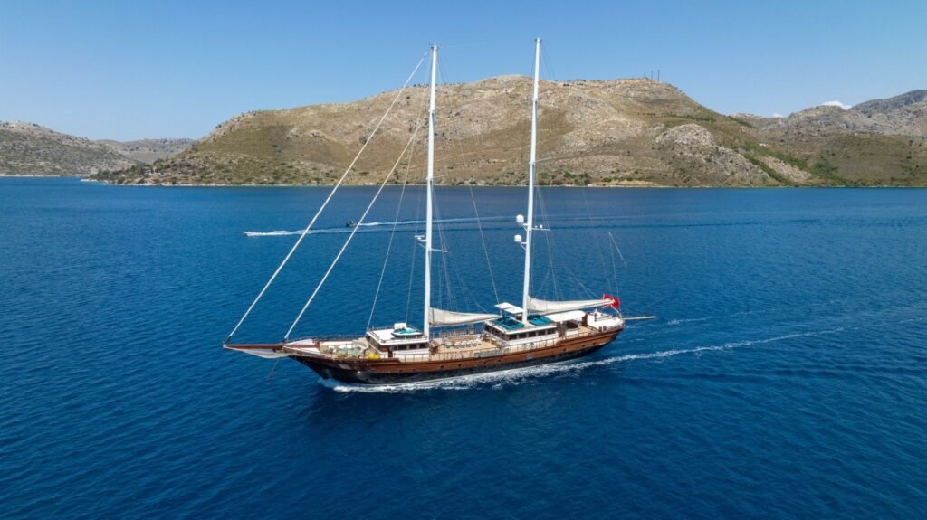 Aerial of a 43m luxury motor sailer underway on the Turkish Riviera — gulet charter MN4308