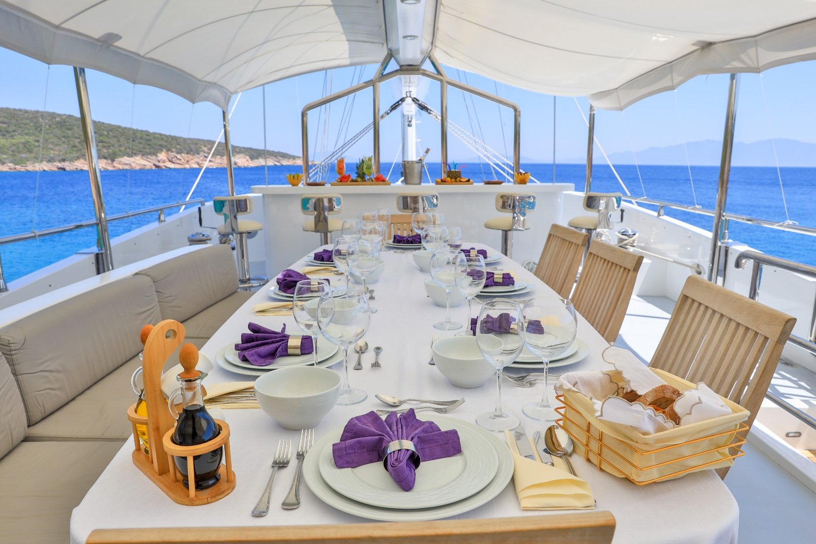 Aft deck dining table laid for lunch aboard a 37m gulet charter — CA3713