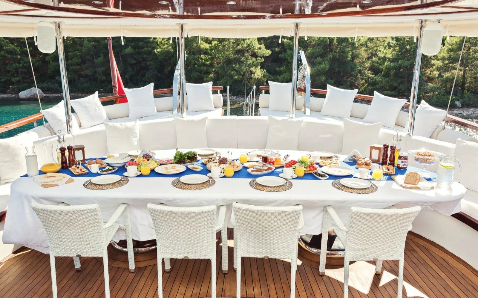 Aft deck dining table laid for breakfast aboard a 42m gulet charter in Marmaris — HM4218