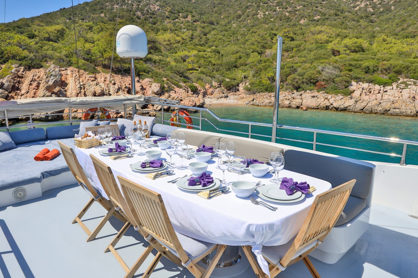 Aft deck dining for twelve aboard a 37m crewed gulet charter — CA3713
