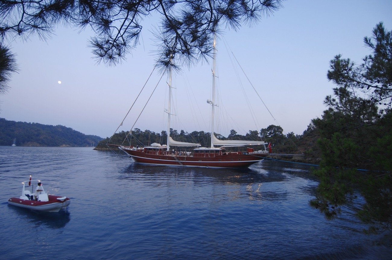 43m motor sailer anchored in a sheltered bay at dusk, Turkish Riviera charter — MN4308