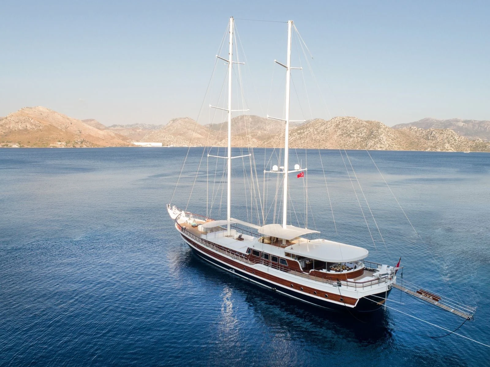 42m gulet at anchor with the Marmaris hills behind — large group gulet charter HM4218