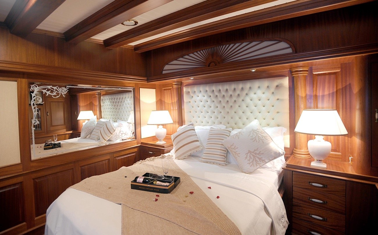 Breakfast in bed in a master cabin aboard a 43m crewed gulet charter yacht — MN4308