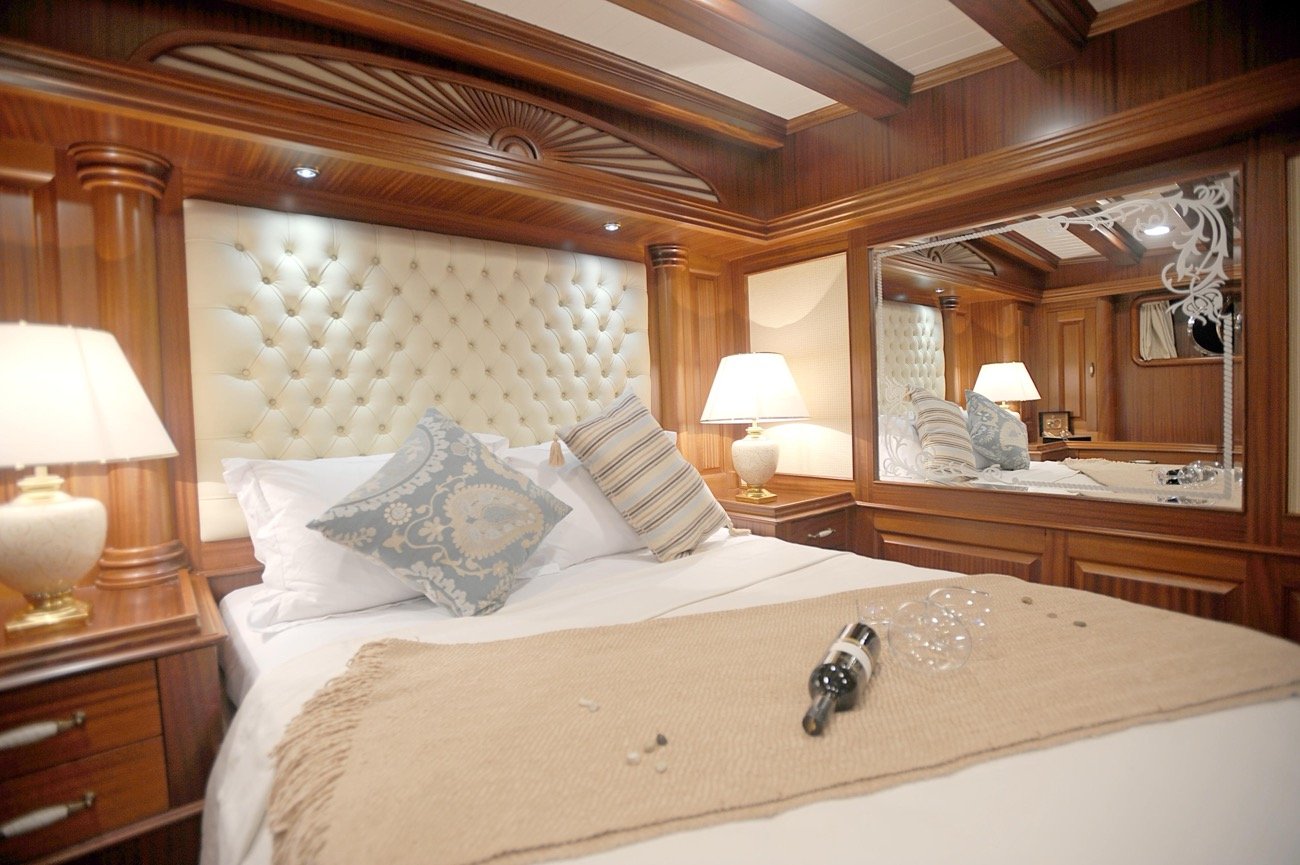 Guest cabin turndown with champagne aboard a luxury 43m motor sailer charter — MN4308