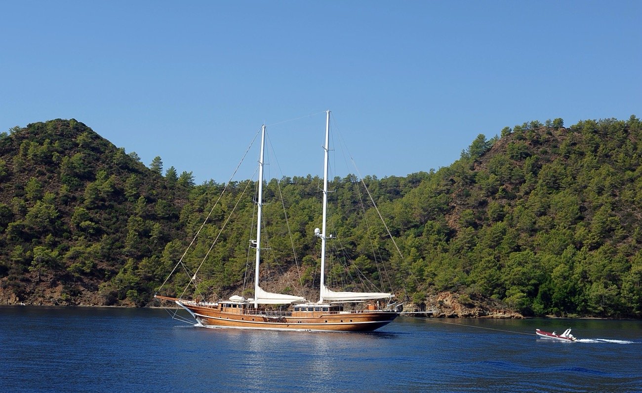 43m motor sailer cruising a pine-fringed bay on a Turkish Riviera yacht charter — MN4308