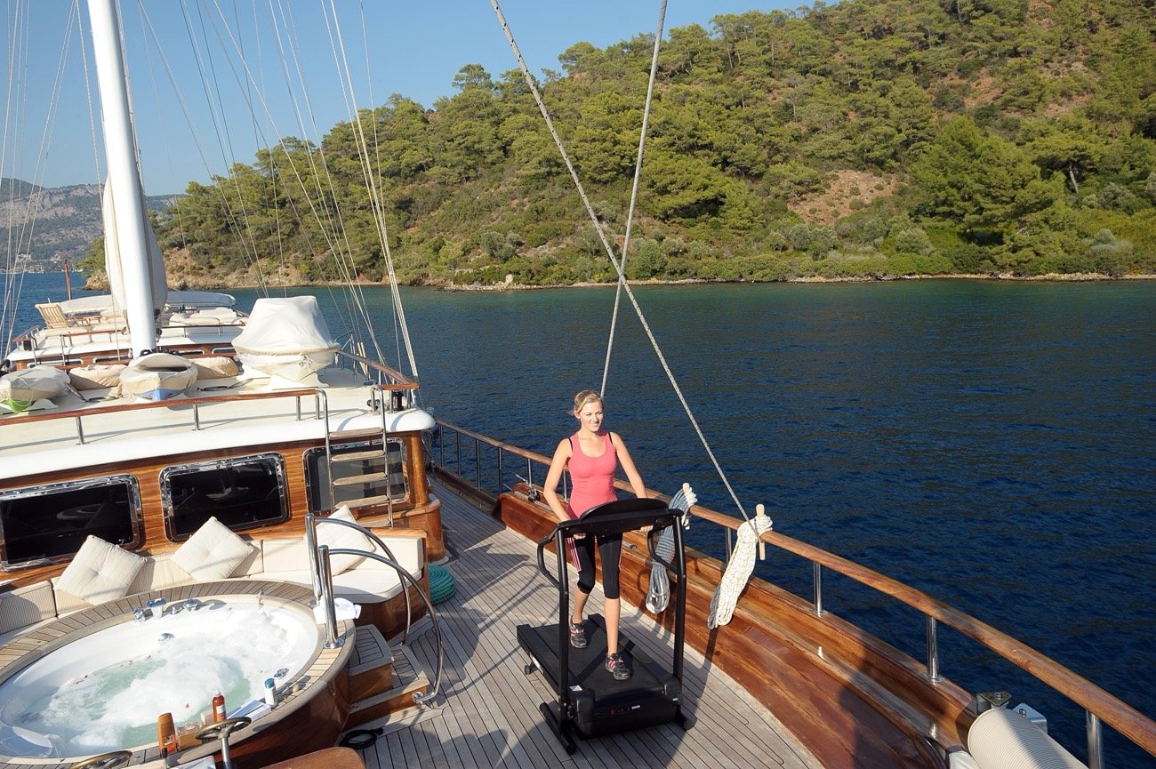 On-deck gym with treadmill aboard a 43m luxury motor sailer charter yacht — MN4308