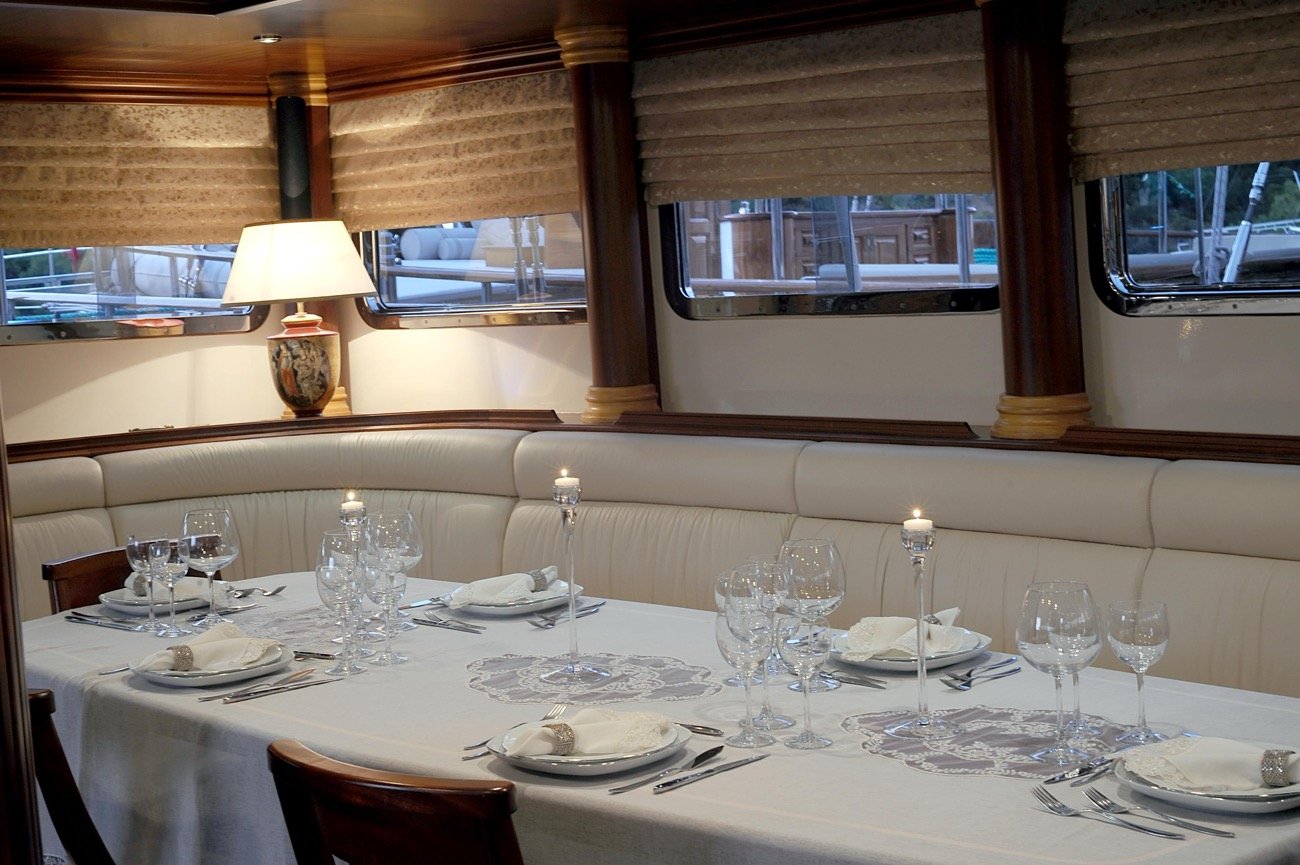 Indoor dining salon set for lunch aboard a 43m crewed charter yacht in Turkey — MN4308