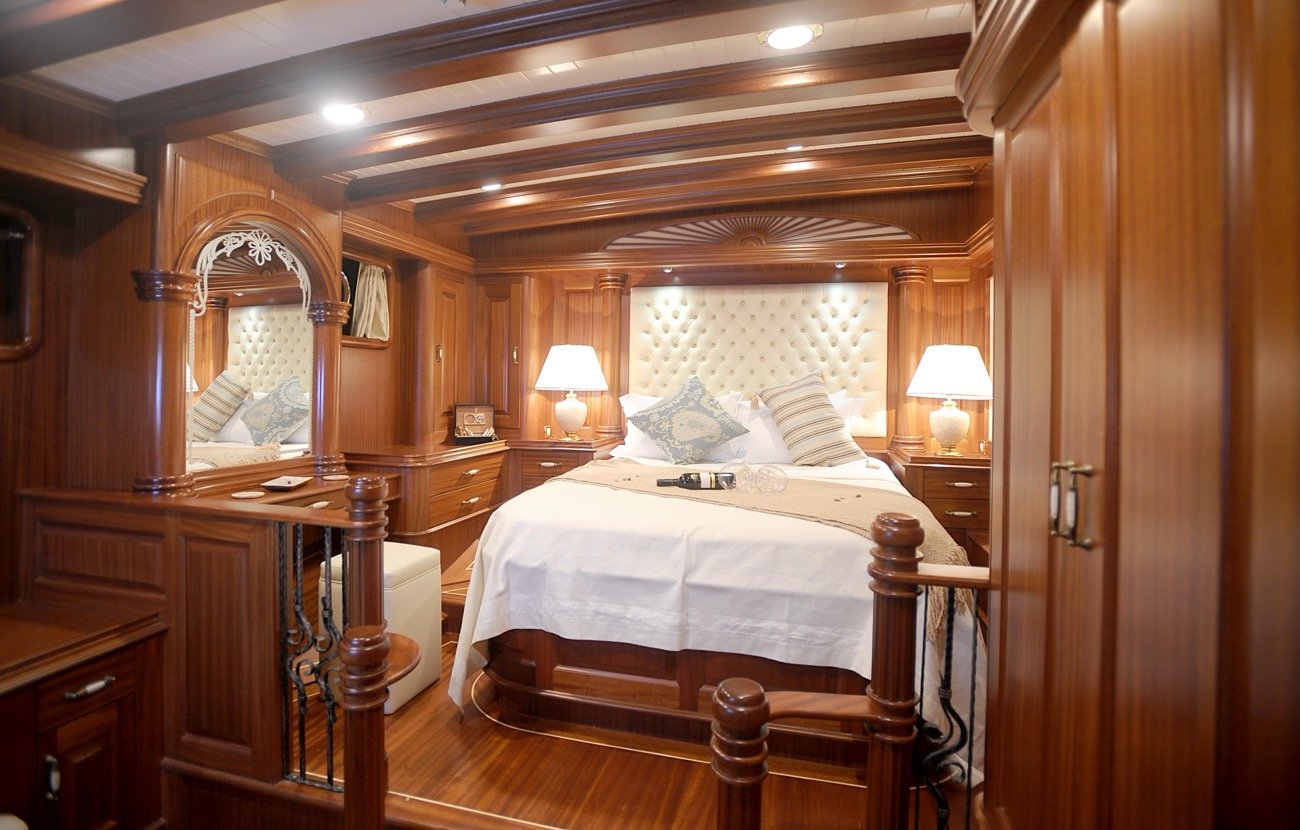 King double cabin in polished mahogany aboard a 43m deluxe gulet charter yacht — MN4308