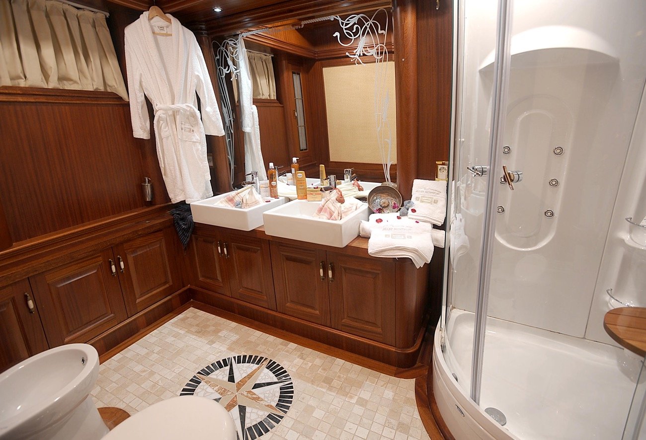 En-suite bathroom with shower cabin aboard a 43m luxury motor sailer charter — MN4308