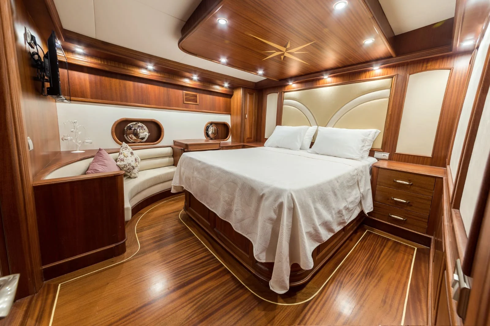 Guest cabin with double bed and walnut joinery aboard a 42m gulet charter — HM4218