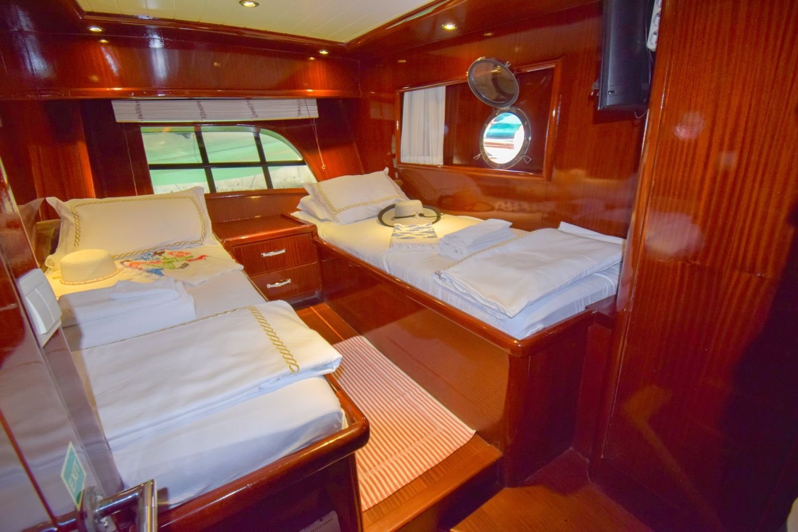 Guest cabin with polished cherry joinery on a gulet charter Marmaris yacht