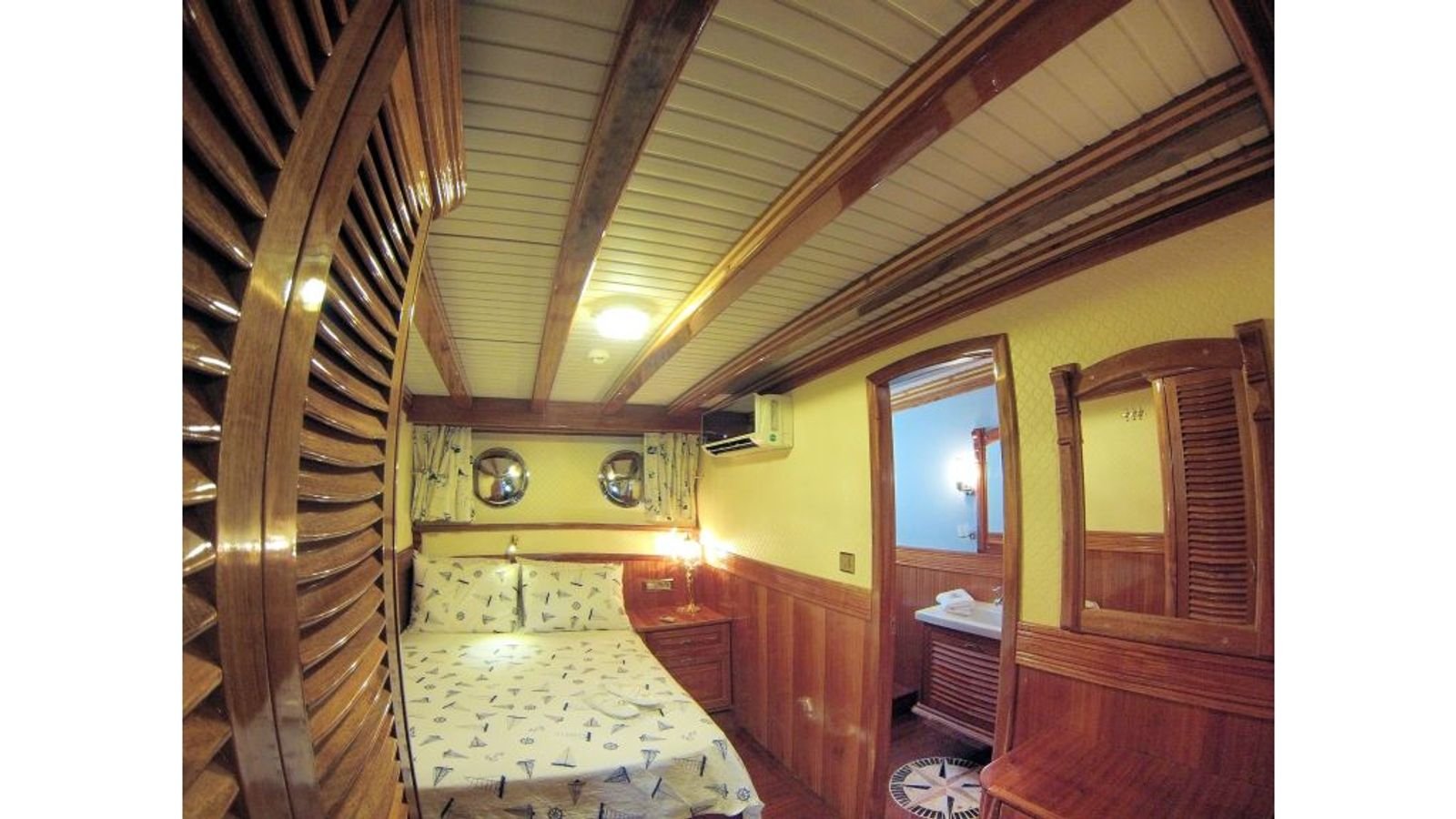 Timber-panelled guest cabin on a gulet charter Fethiye yacht