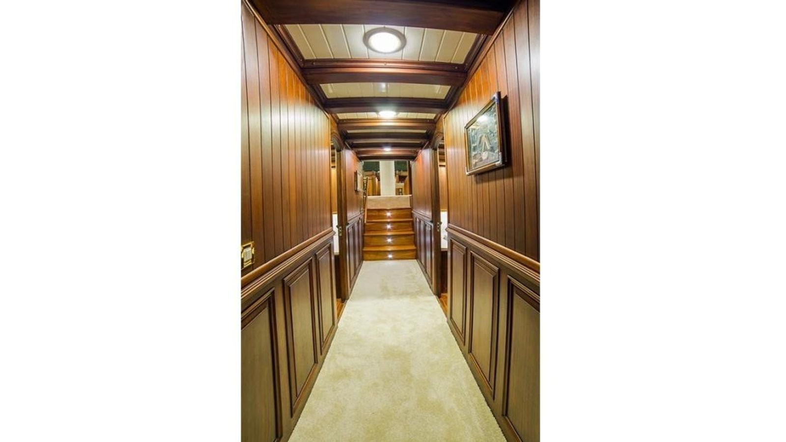 Guest corridor panelled in mahogany on a traditional gulet charter Bodrum vessel
