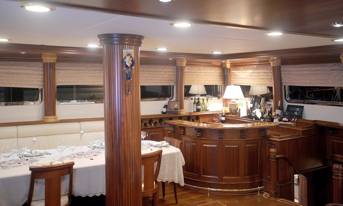 Air-conditioned indoor dining saloon and bar aboard a 43m motor sailer charter yacht — MN4308