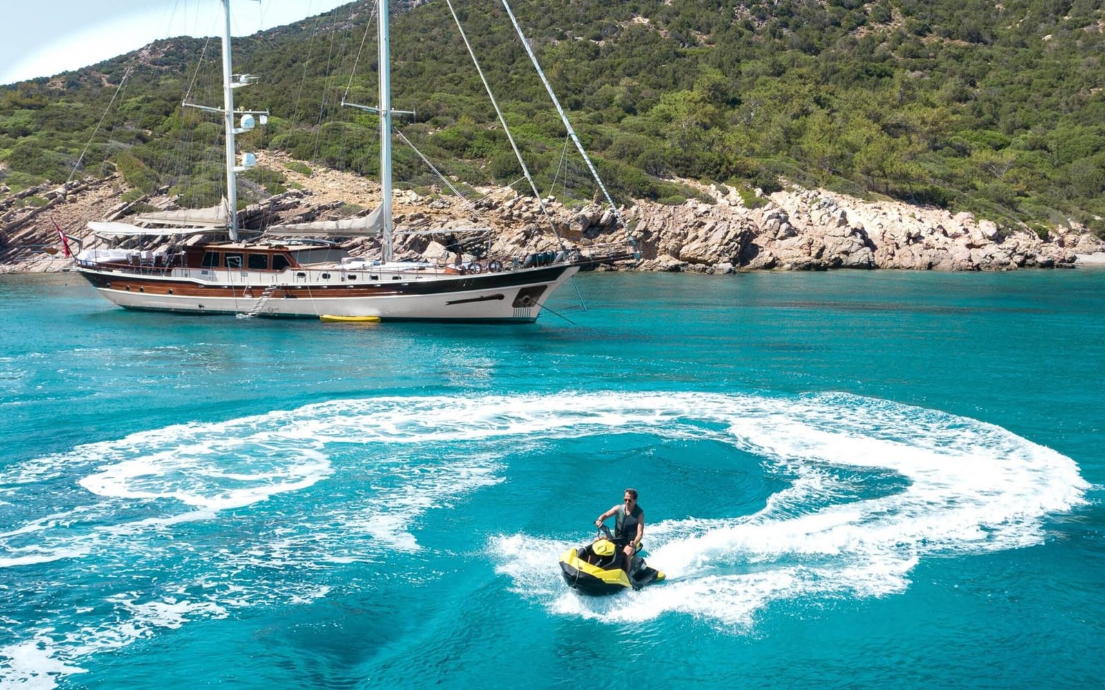 Jet ski alongside a 30m deluxe gulet at anchor near Bodrum — ED3011