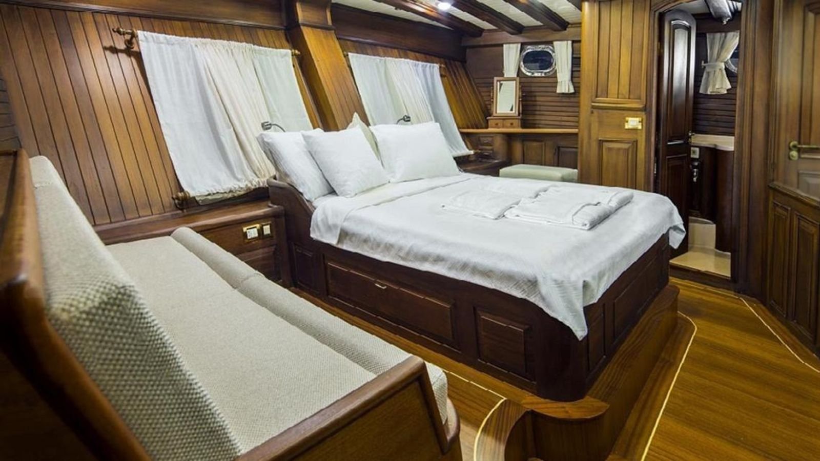 Master cabin panelled in mahogany on a traditional gulet charter Bodrum yacht