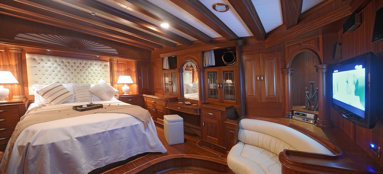 Full-beam master suite with king bed and lounge aboard a 43m luxury gulet charter — MN4308