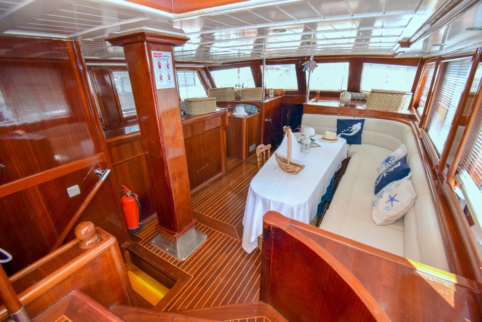 Saloon with dining table and banquette seating on a gulet charter Marmaris vessel