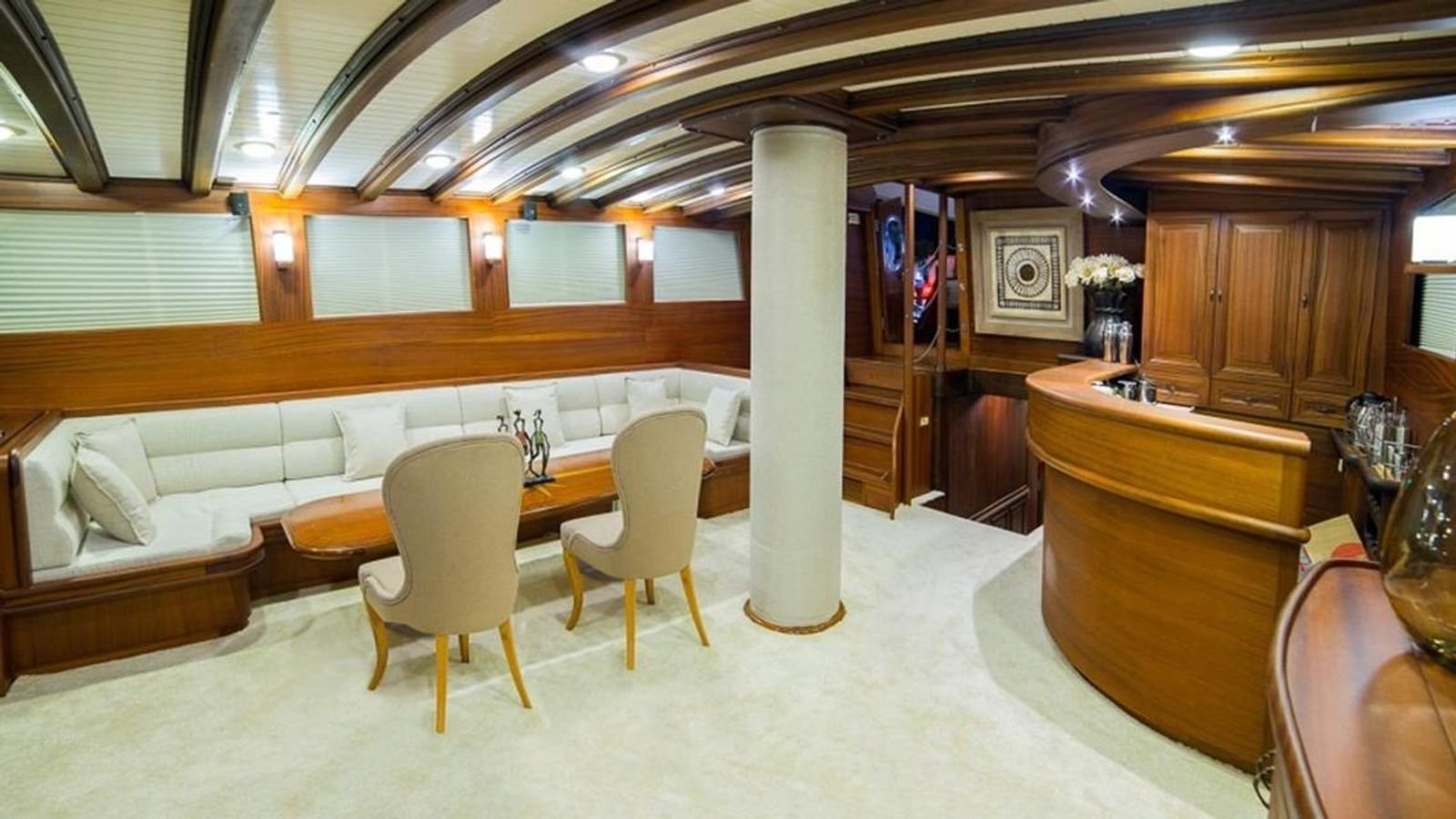 Saloon dining between carved columns aboard a traditional gulet charter Bodrum yacht