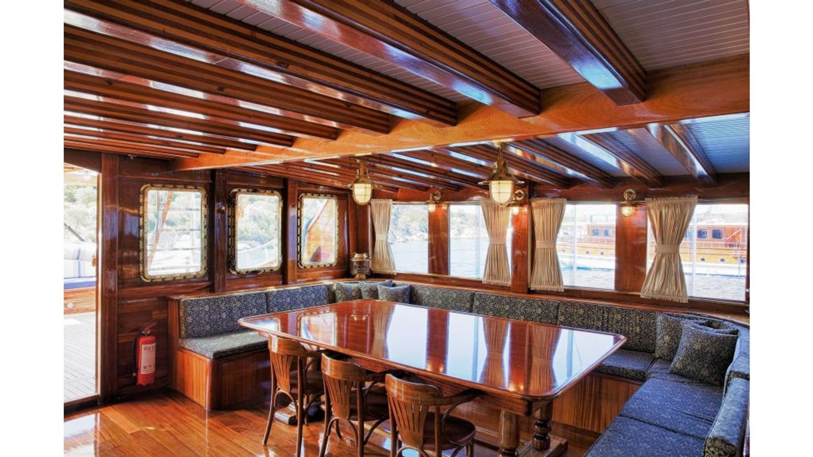 Saloon dining table aboard a gulet charter Fethiye yacht