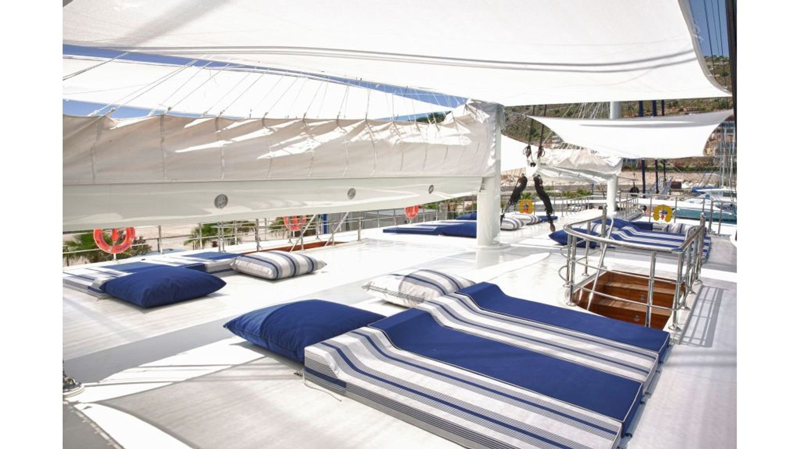 Sun mattresses on the shaded deck of a gulet charter Fethiye vessel