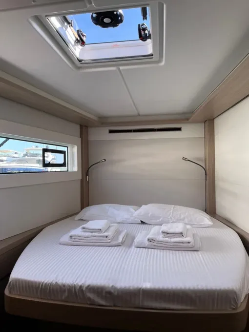 Double cabin aboard the Lagoon 46 catamaran charter in Gocek, made up with fresh linen and towels