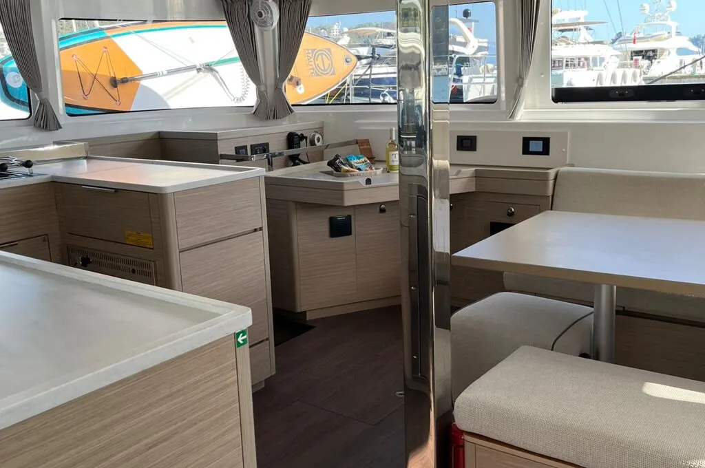 Galley of the Lagoon 46 charter catamaran with a long worktop, sink and access to the port hull