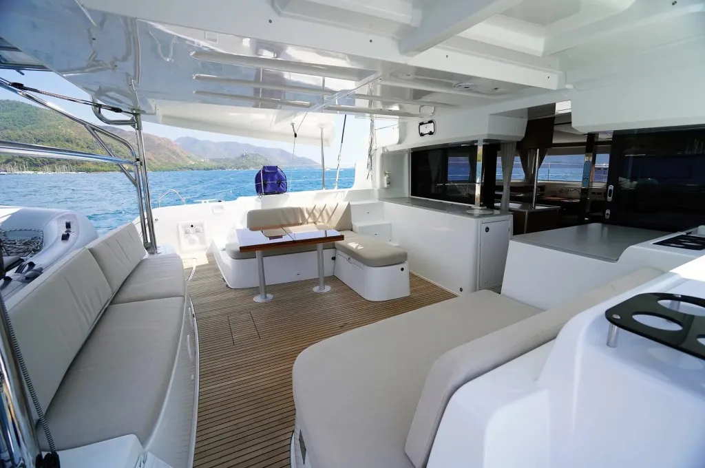 Aft cockpit of a Lagoon 46 charter catamaran looking through the sliding doors into the saloon