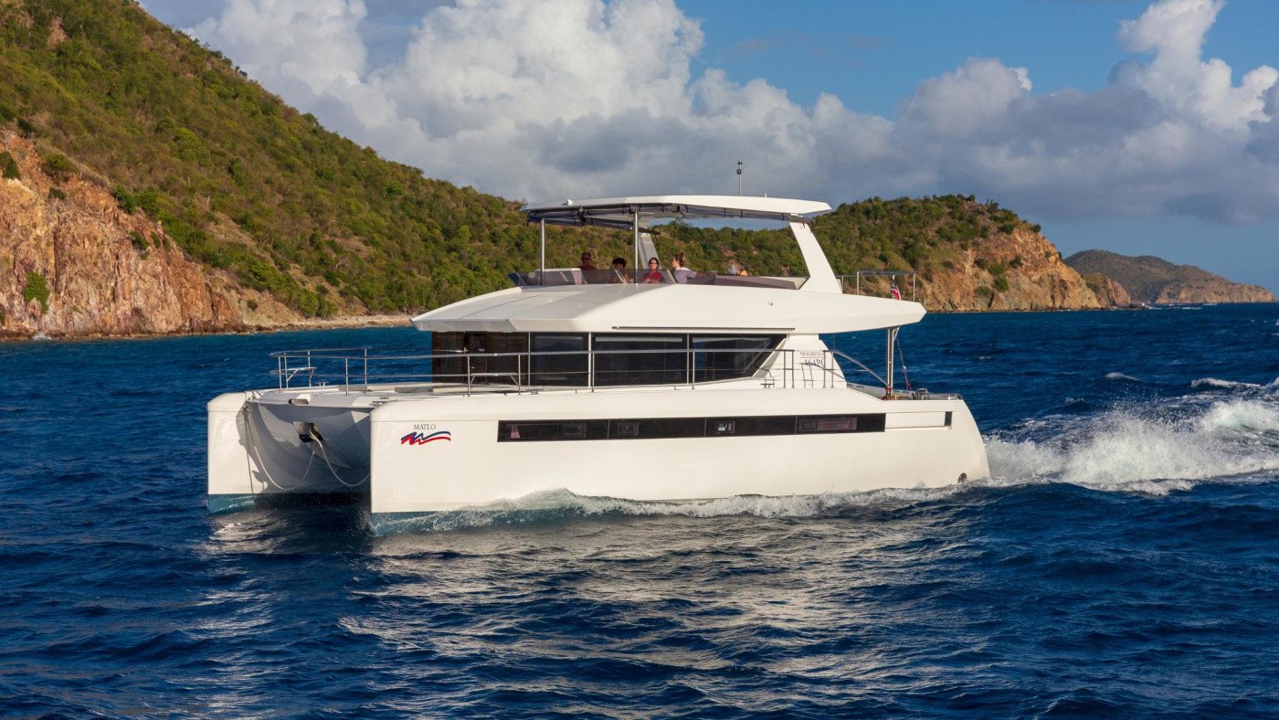 Leopard 46 power catamaran charter Fethiye cruising at speed, bow quarter view showing the fine catamaran hulls