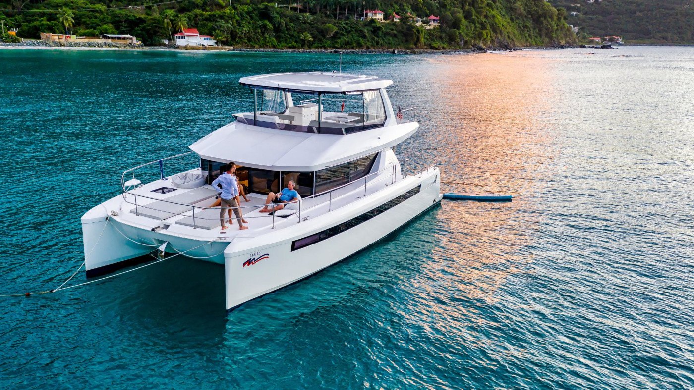 Leopard 46 power catamaran charter Fethiye lying quietly at golden hour with guests on the flybridge