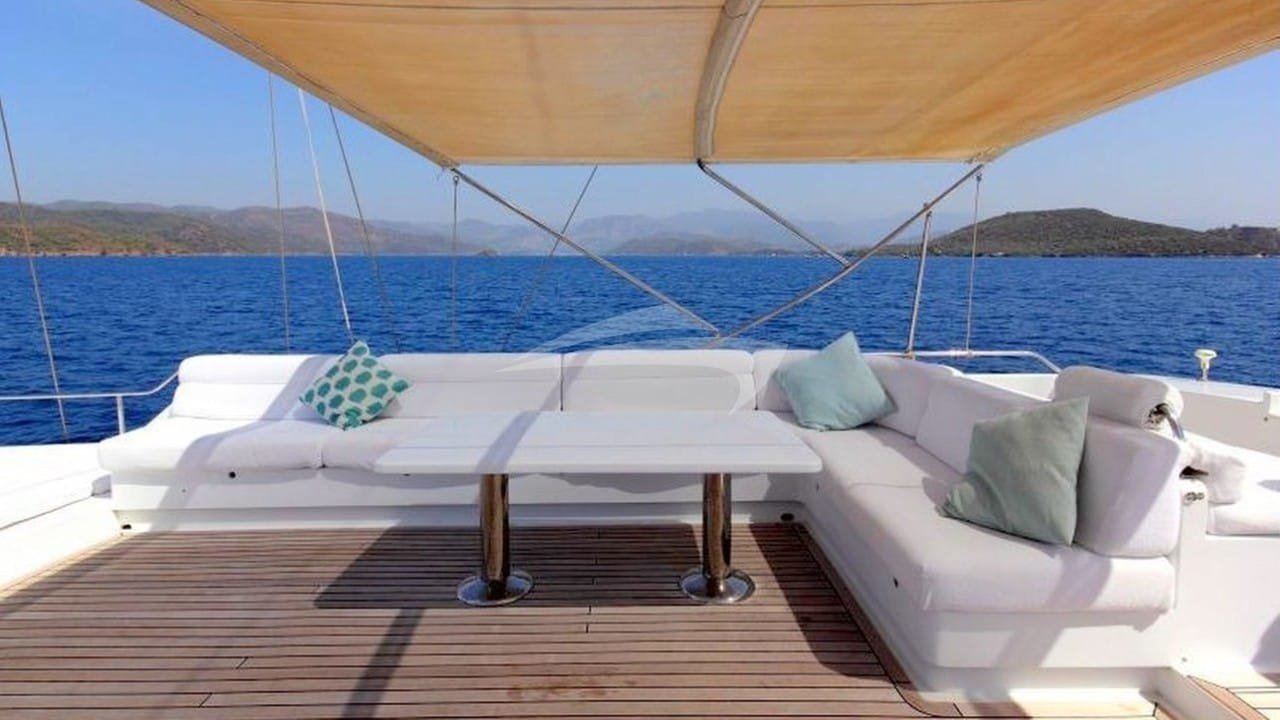 Shaded aft deck seating aboard a luxury crewed yacht in Bodrum, Turkey