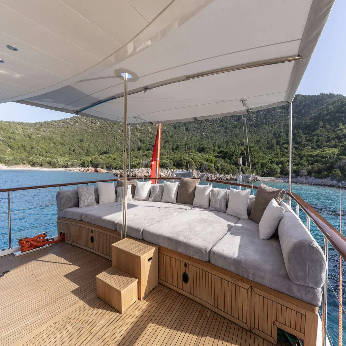 Aft lounge deck with sail rig overhead on a luxury motor sailer charter Bodrum yacht