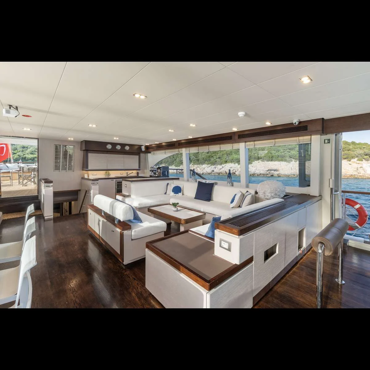 Open-plan saloon and galley aboard a luxury motor sailer charter Bodrum vessel