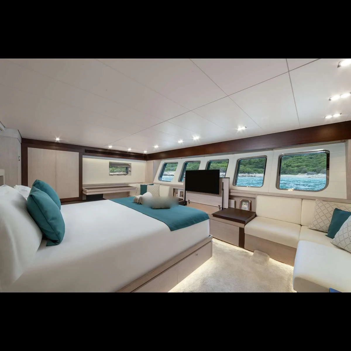 Guest cabin with lounge seating on a luxury motor sailer charter Bodrum vessel