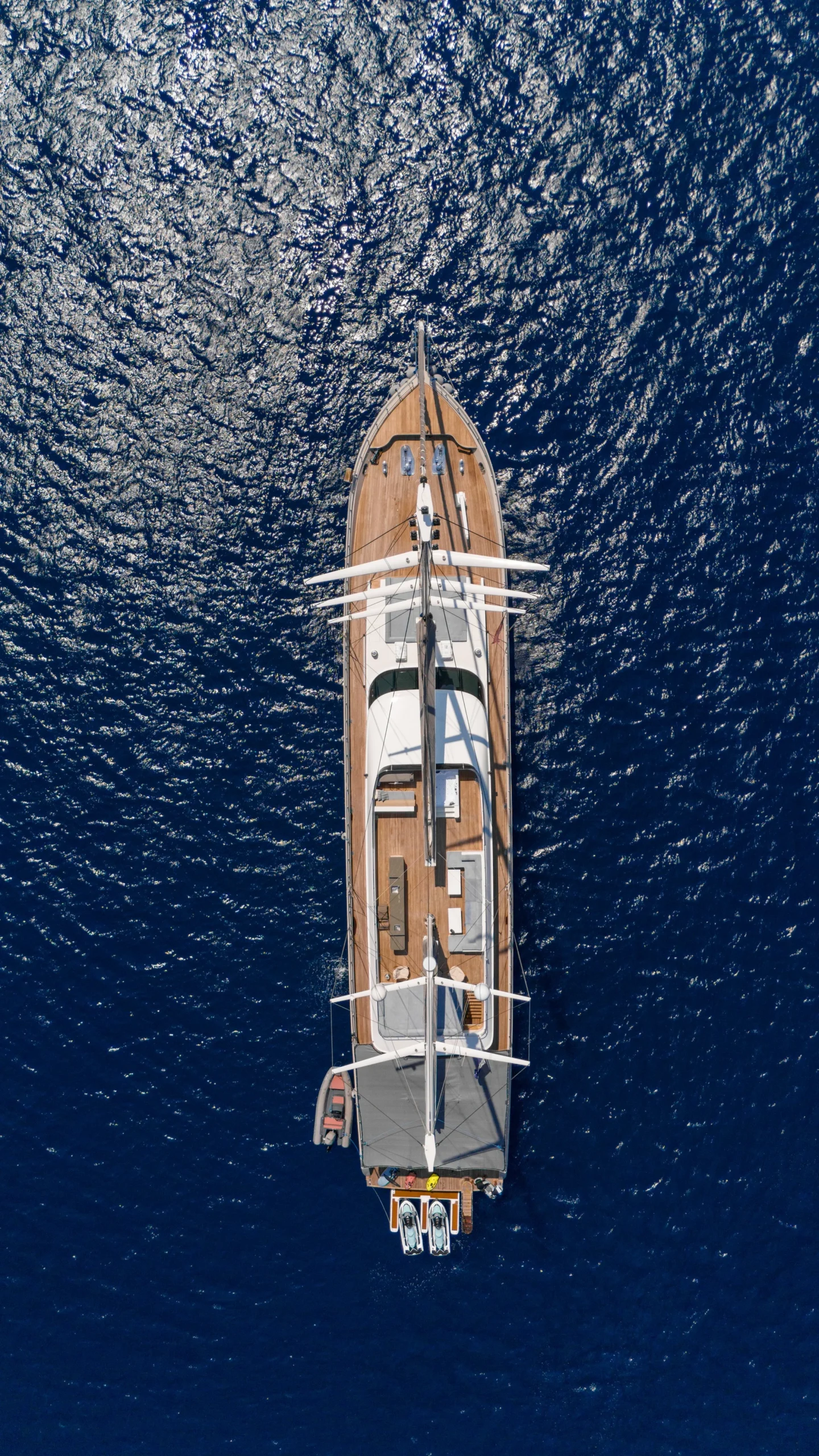 Aerial drone view of DL5024 luxury sailing yacht deck layout at anchor