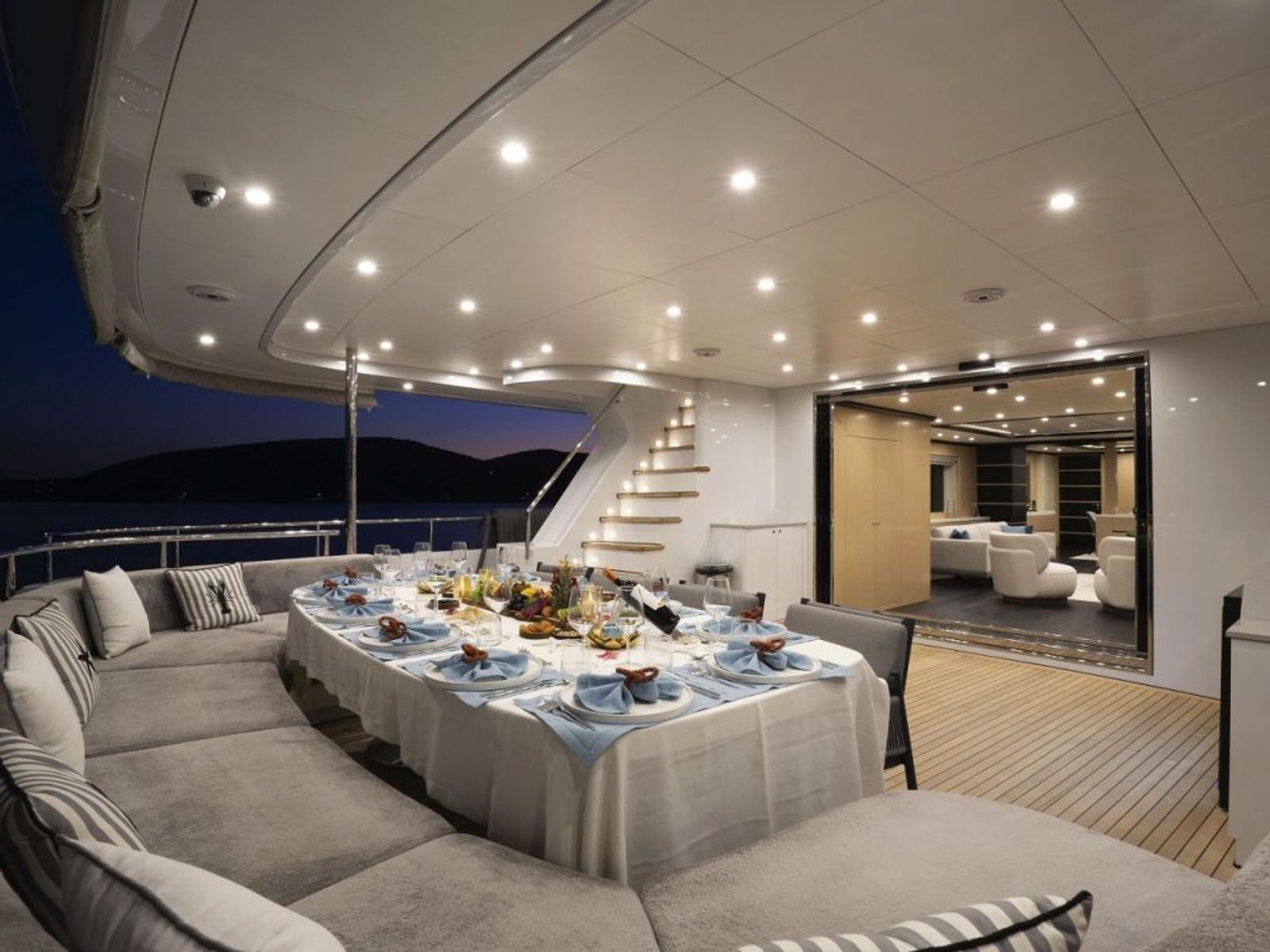 Main saloon with dining table aboard a 42m luxury motor yacht charter in Turkey