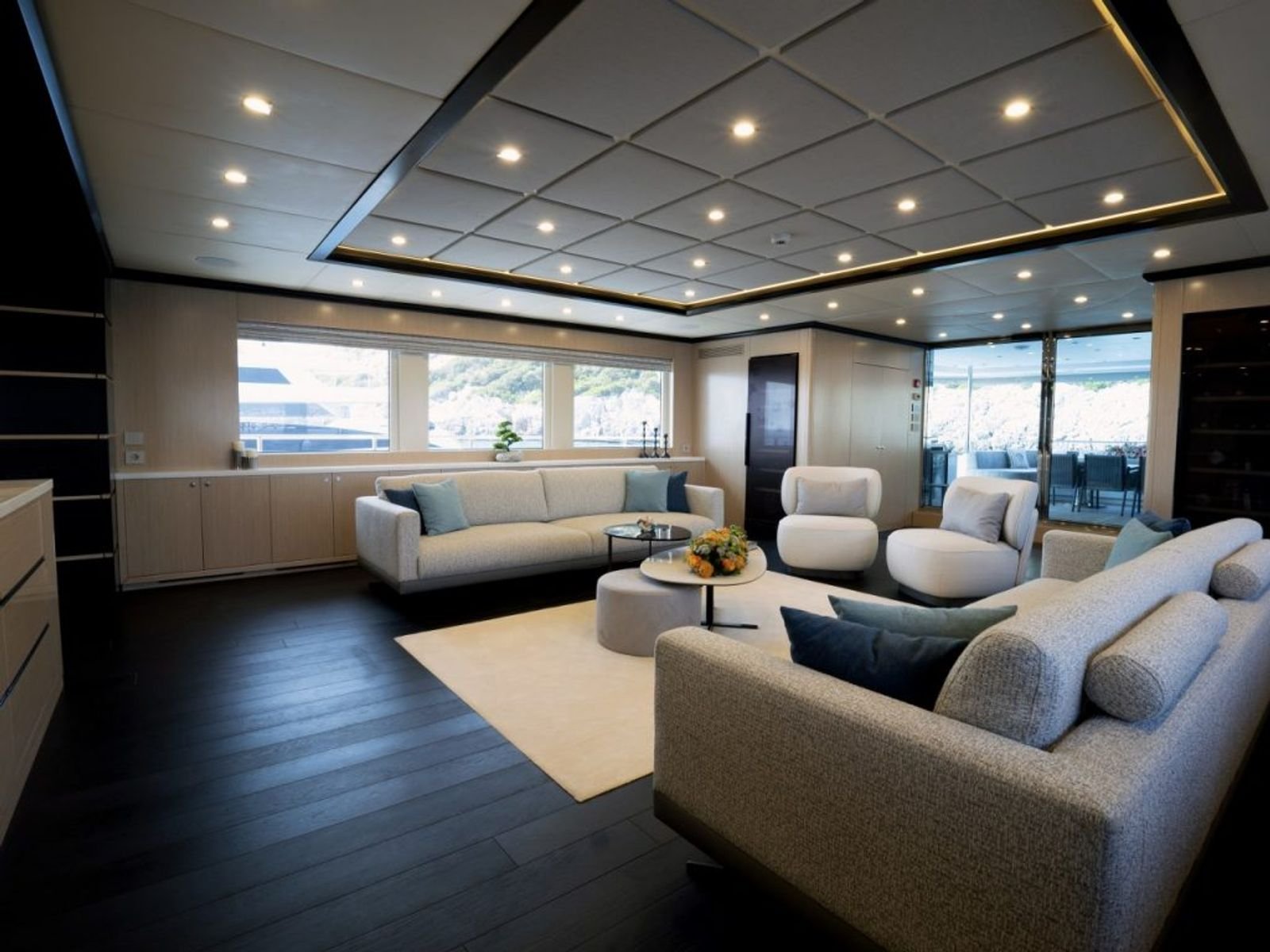 Saloon lounge in oak and smoked oak aboard a luxury motor yacht in Turkey