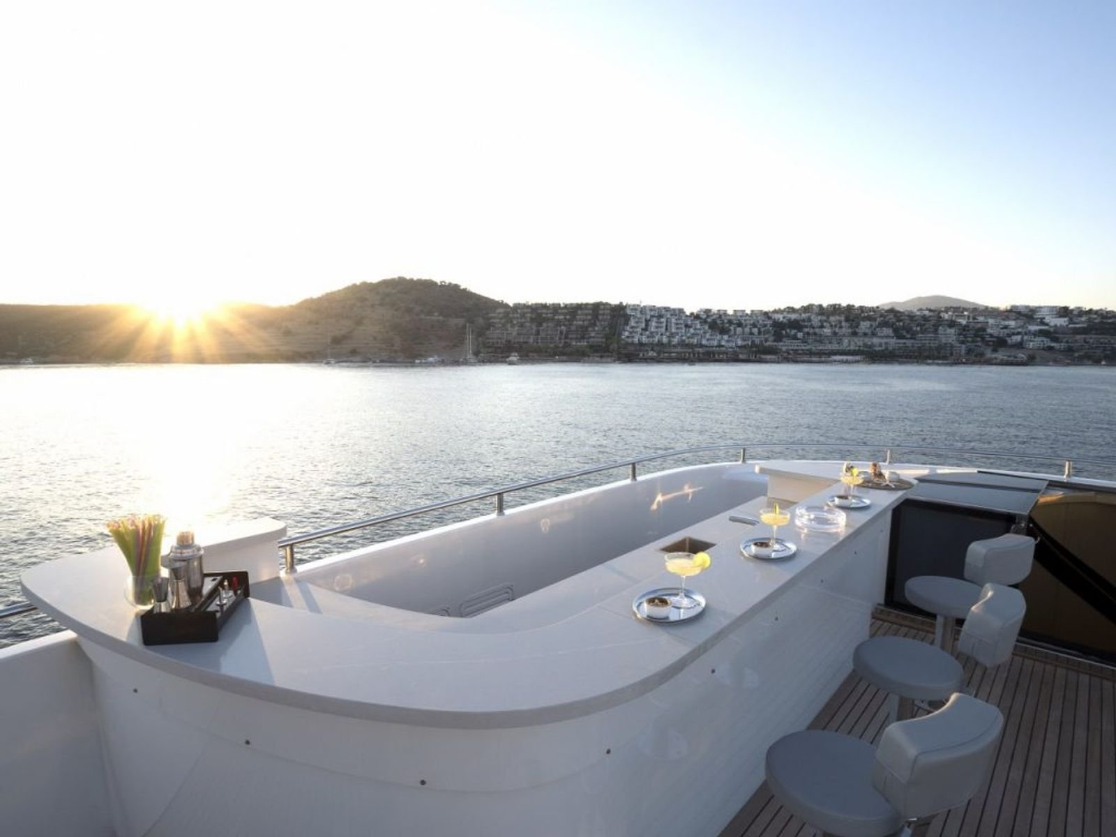 Sundeck jacuzzi at sunset aboard a 42m luxury motor yacht charter in Turkey