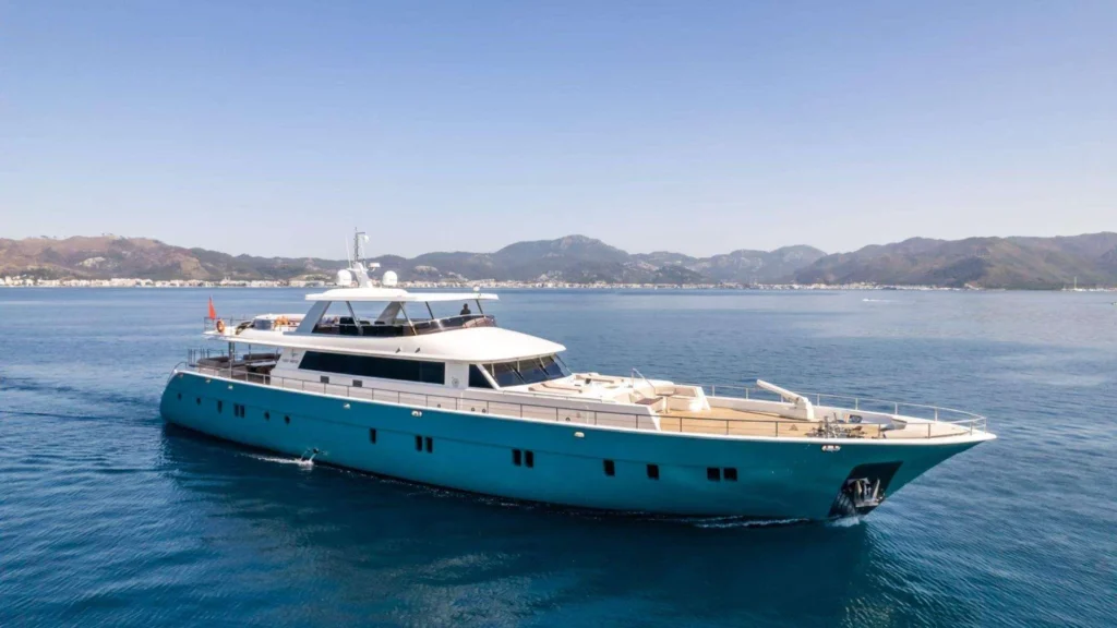 39.2m luxury yacht charter Marmaris motor yacht at anchor with turquoise hull on the Turkish Riviera