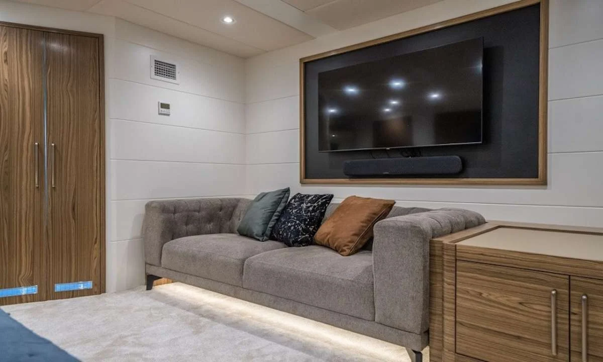 Cabin seating area with sofa and flatscreen on a luxury yacht charter Marmaris motor yacht