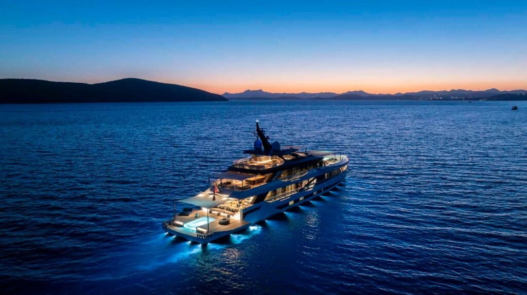 Mega yacht charter Bodrum - 50m Ada Yacht Works at anchor at dusk with underwater lighting